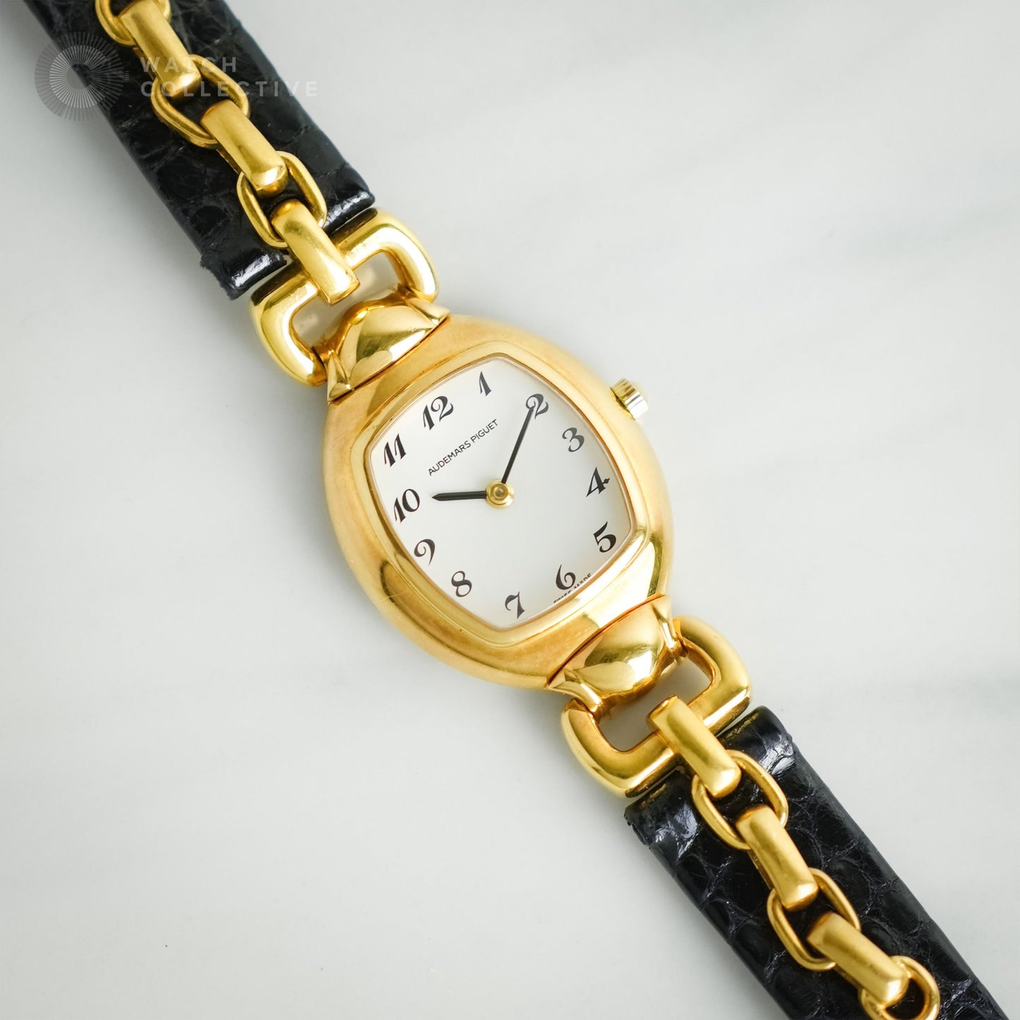 Audemars Piguet Audemarine 18k Yellow Gold White dial, black Arabic numerals and hands quartz tonneau 66559BA