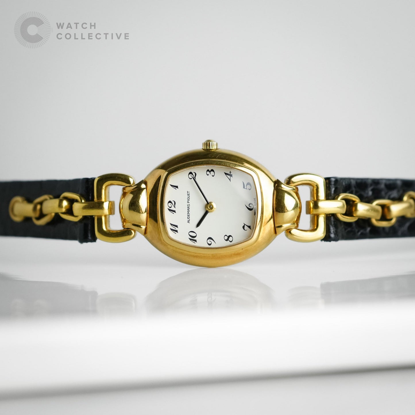Audemars Piguet Audemarine 18k Yellow Gold White dial, black Arabic numerals and hands quartz tonneau 66559BA